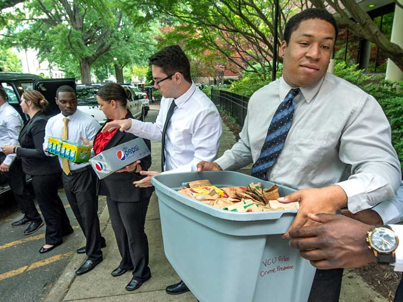 community service volunteers assembling donations to a food bank
